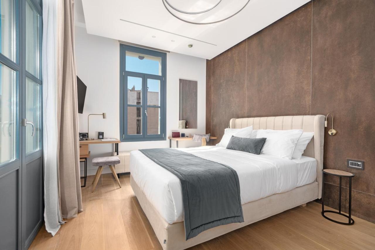Hellenic Vibes Smart Hotel Athen Exterior foto A bedroom at the hotel