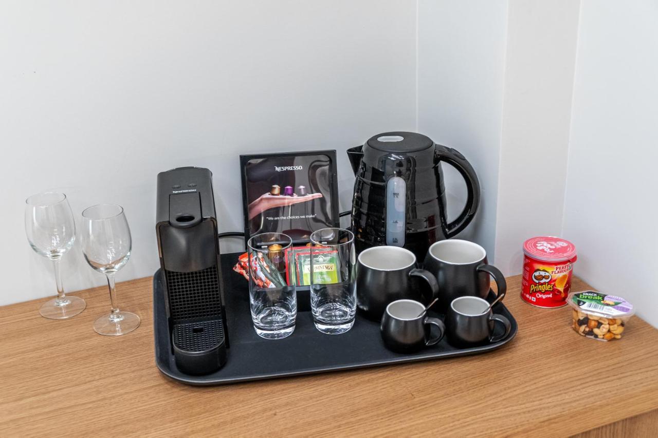 Hellenic Vibes Smart Hotel Athen Exterior foto A Nespresso coffee machine in a hotel room
